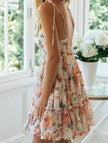 FJØRNA resort style white high-end short dress with vibrant print, perfect for summer or beach outings.
