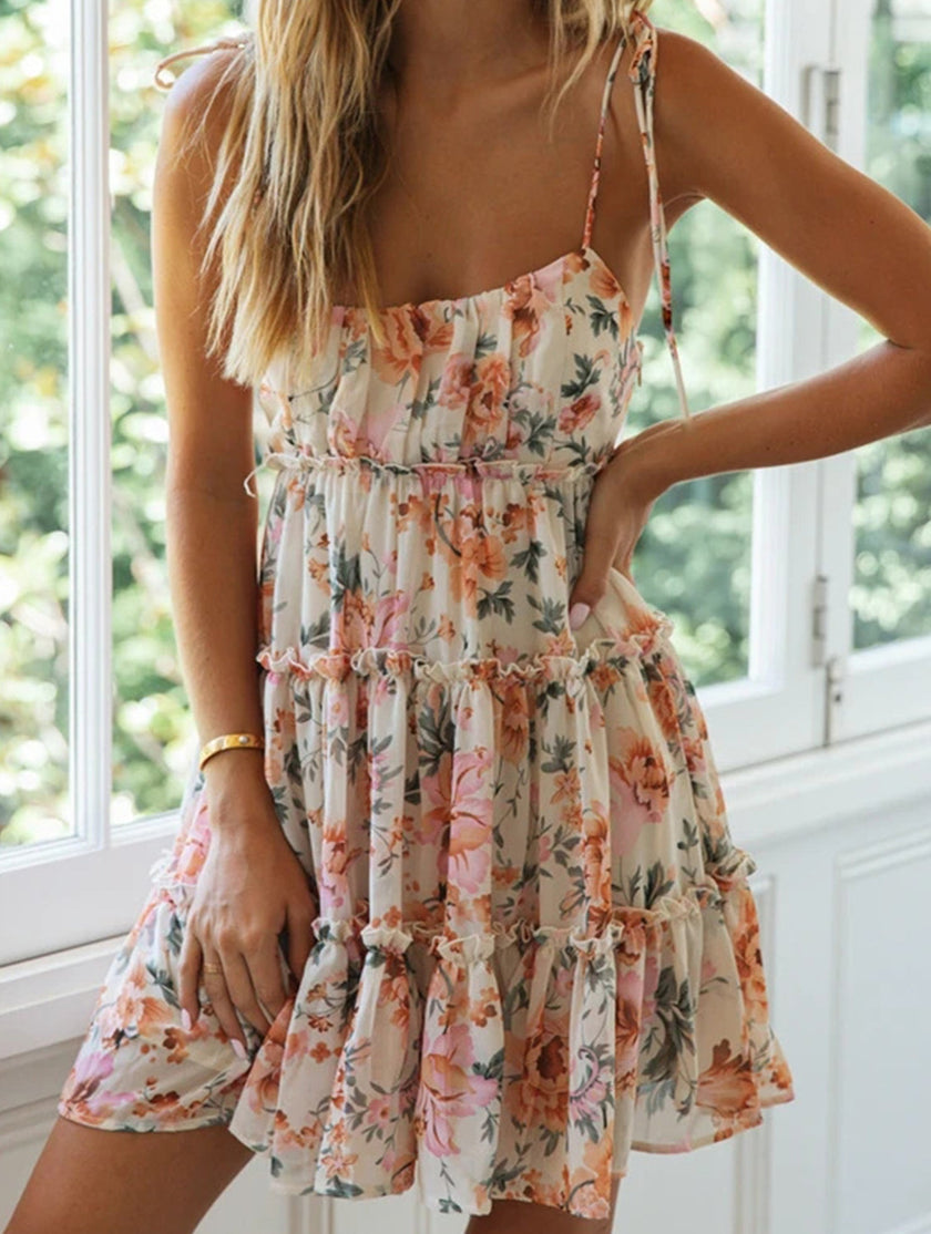 White resort style print high-end short dress by FJØRNA, featuring a chic, lightweight design perfect for warm weather.