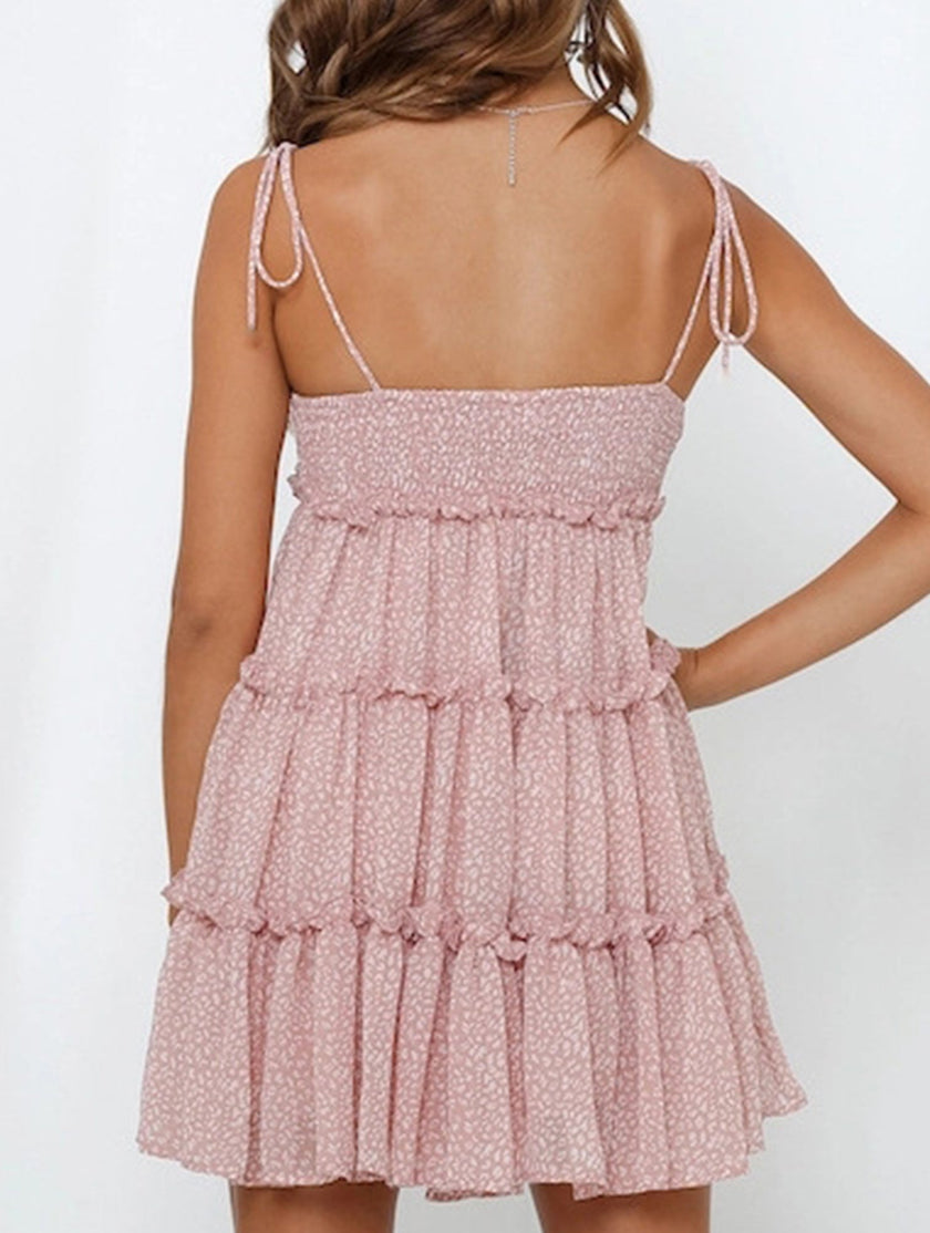 White resort style print high-end short dress by FJØRNA, featuring elegant design and lightweight fabric perfect for warm weather.