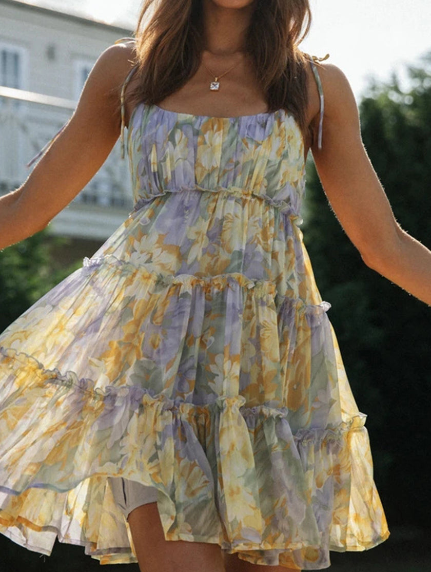 FJØRNA resort style high-end white short dress with print, featuring a chic, elegant design perfect for summer or special occasions.