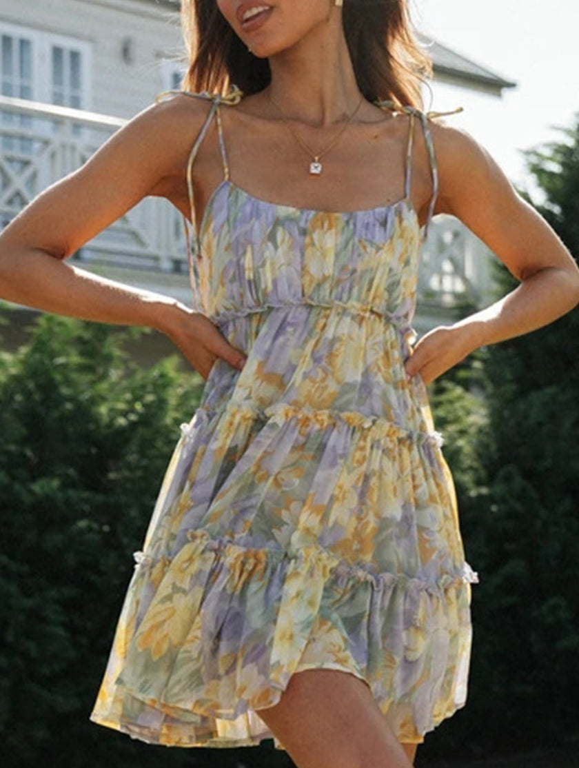 FJØRNA resort style white high-end short dress with a print, perfect for summer or vacation wear.