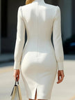 White high neck long sleeve slim fit dress by FJØRNA, shown on a model, emphasizing its elegant silhouette and modern style.