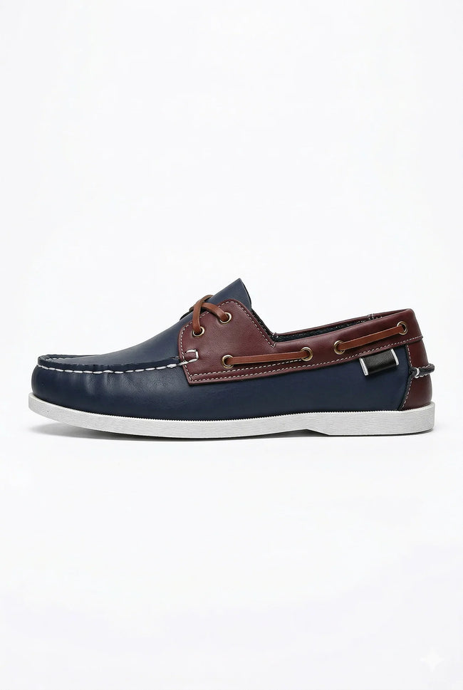 FJØRNA men's nautical boat shoes with PU upper, featuring classic deck style and slip-on design for casual maritime look.