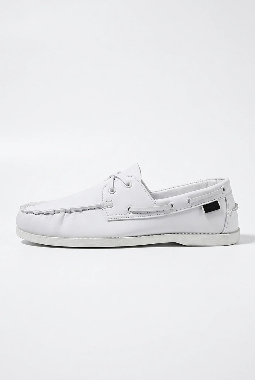 FJØRNA men's nautical boat shoes with PU upper, featuring classic deck shoe design and white laces on a light background.