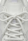 White mesh trainers for women by FJØRNA, breathable lightweight casual shoes with cushioned soles and sporty design.