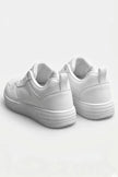 White minimalist women’s casual trainers by FJØRNA, showing sleek, classic white shoes with clean design and comfortable fit.