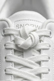 White minimalist FJØRNA women's casual trainers with clean design and classic silhouette, perfect for everyday wear.