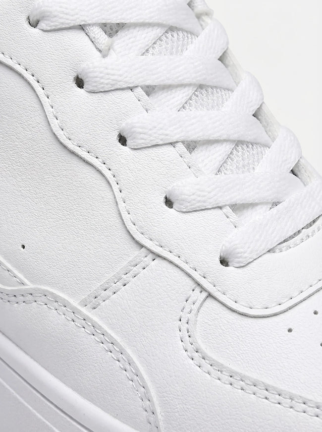 FJØRNA white minimalist men's trainers, clean everyday shoes with a sleek design and comfortable fit, shown from the side.