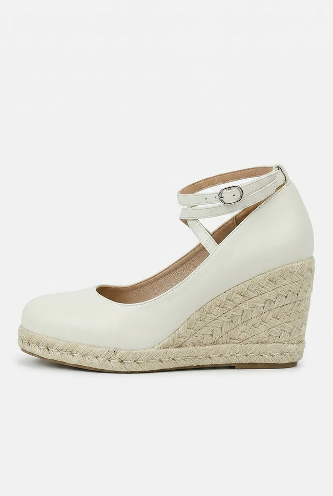 Women's ankle-strap espadrille wedge sandals by FJØRNA, featuring a stylish platform design and elegant ankle straps.