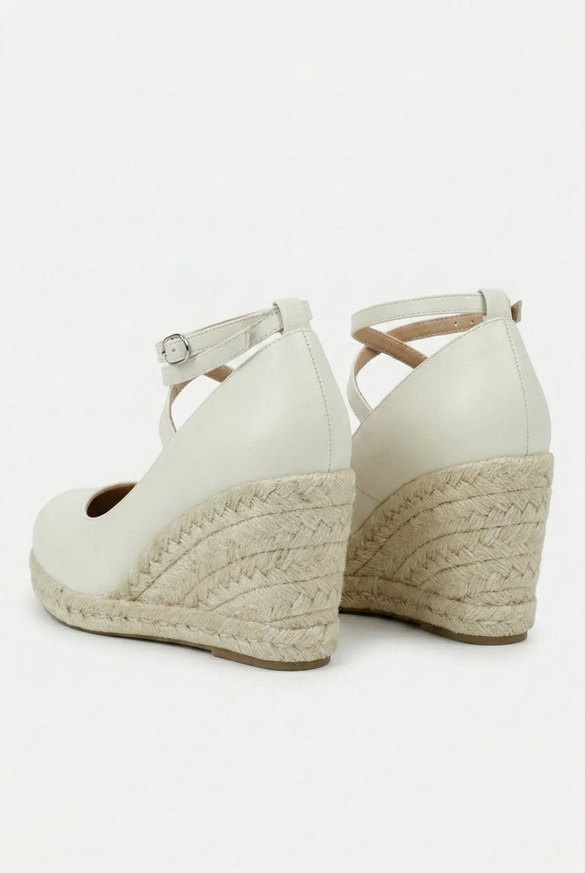 Women's ankle-strap espadrille wedge sandals by FJØRNA featuring platform sole and stylish design, shown from a side view.