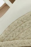 Women's ankle-strap espadrille wedge sandals by FJØRNA featuring platform soles and elegant design, shown from a side angle.