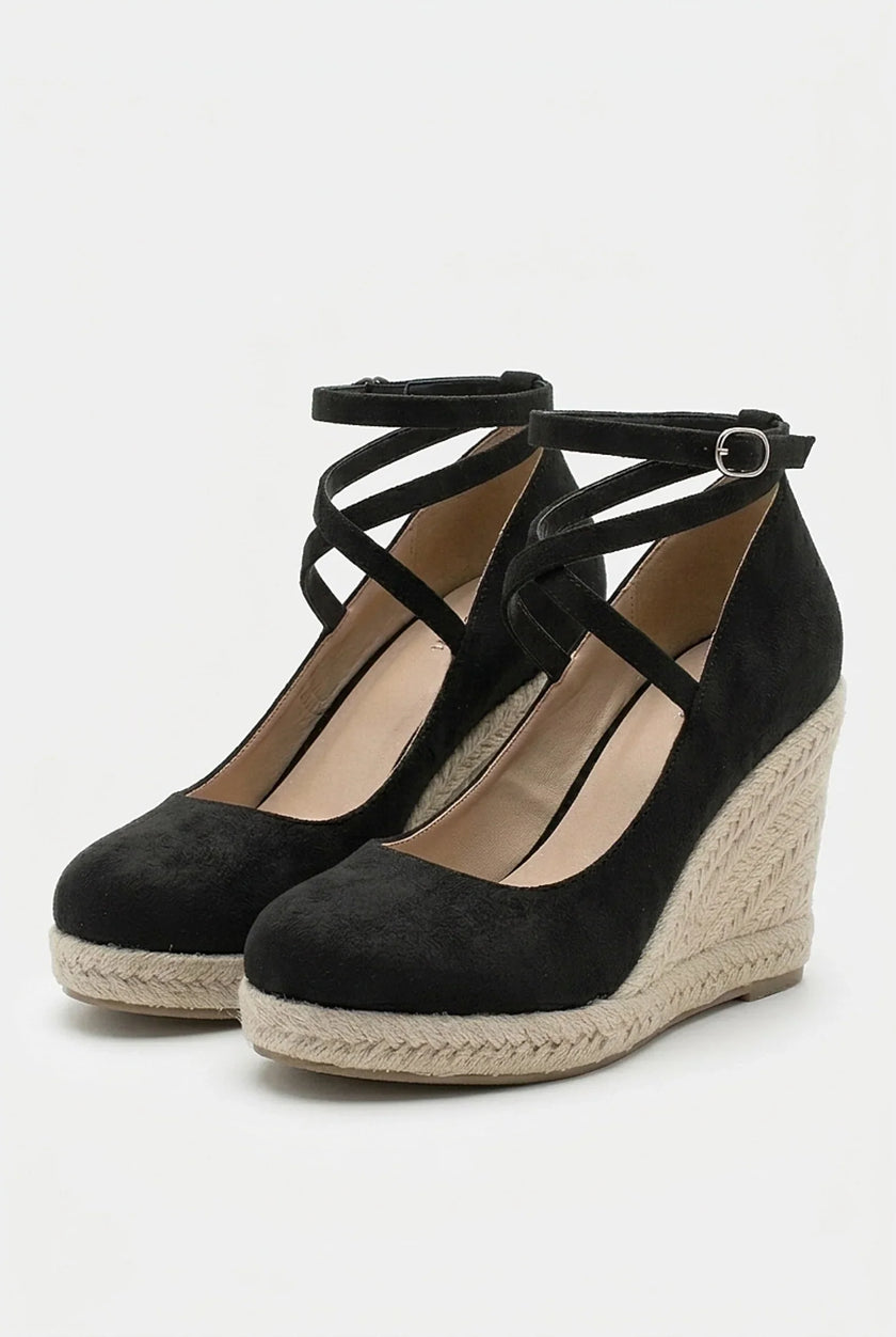 Women's ankle-strap espadrille wedge sandals by FJØRNA, featuring a platform sole and stylish design, shown from a side angle.