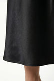 FJØRNA satin high-waist flowing midi skirt for women, elegant pencil style in a luxurious fabric, shown in a stylish side view.