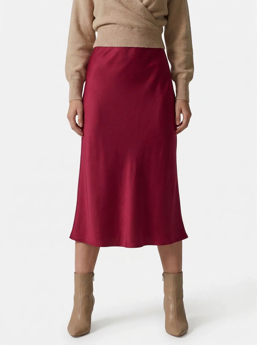 FJØRNA satin high-waist flowing midi skirt for women, elegant pencil style in a smooth, shiny fabric with a flattering fit.