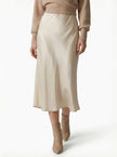 FJØRNA satin high-waist flowing midi skirt for women, elegant pencil style in a smooth satin fabric, shown in a stylish angle.