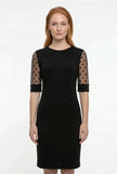 FJØRNA black A-line lace sleeve midi dress with contrast details, stylish and elegant for formal occasions.