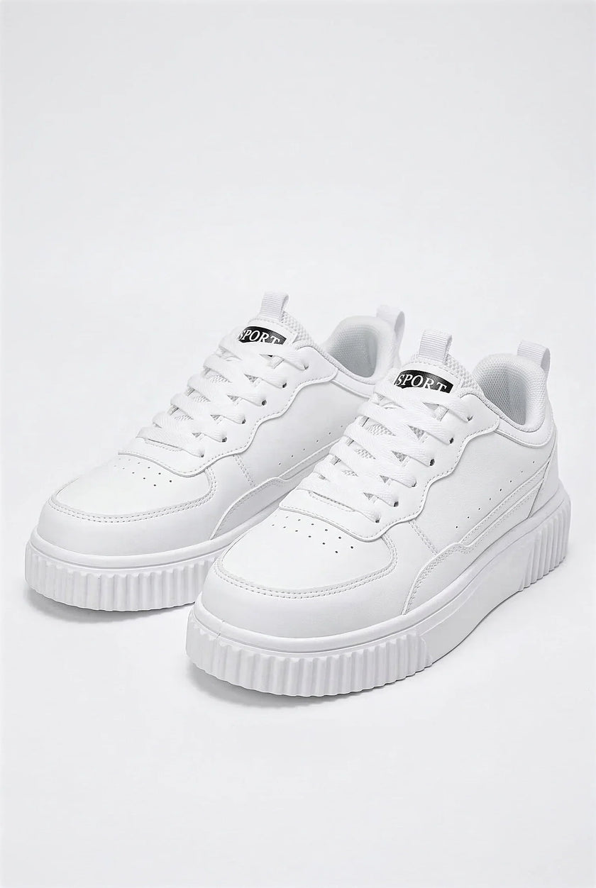 White FJØRNA women's breathable casual trainers with lightweight design, shown from a side angle on a plain background.