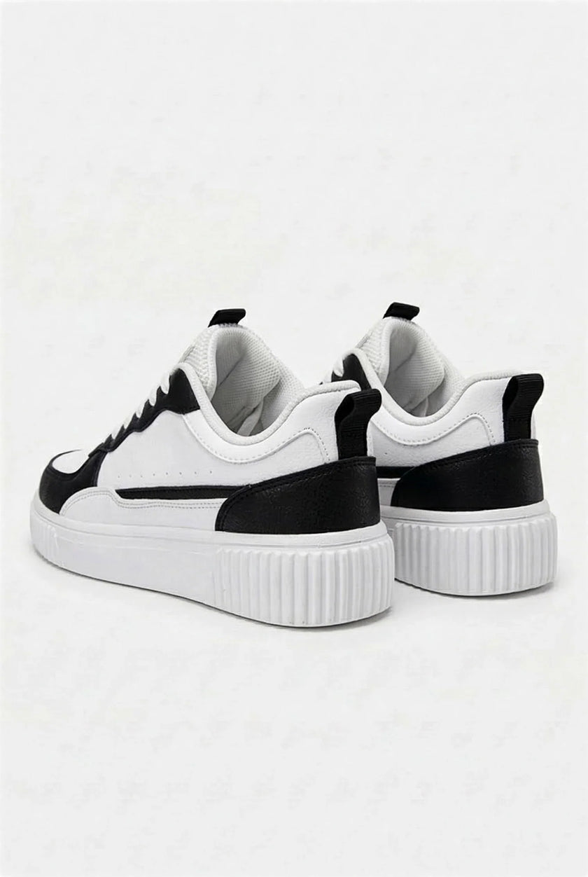 White breathable women's trainers by FJØRNA, lightweight casual sneakers with a comfortable fit and stylish design.