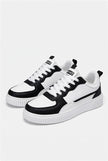 White minimalist men's trainers by FJØRNA, lightweight casual shoes with clean design, suitable for everyday wear.