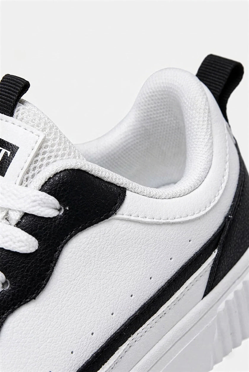 White breathable FJØRNA women's lightweight casual trainers, showing side view of comfortable everyday shoes for women.