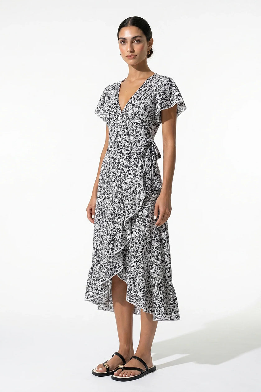 FJØRNA floral midi dress for women, black and white A-line casual summer dress with a full-body view.