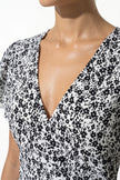 Elegant floral midi dress for women by FJØRNA, featuring an A-line casual summer design in black and white.