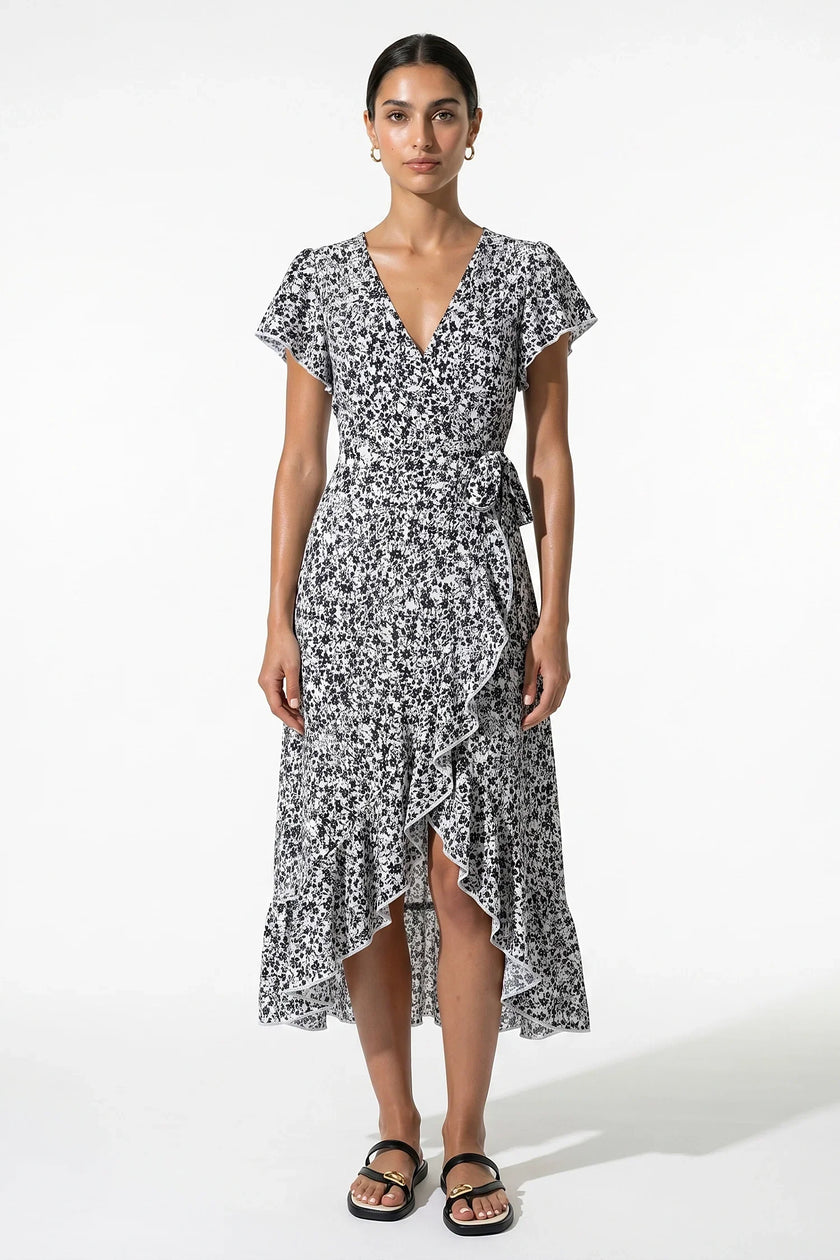 Elegant floral midi dress for women by FJØRNA, featuring an A-line silhouette in black and white for casual summer wear.