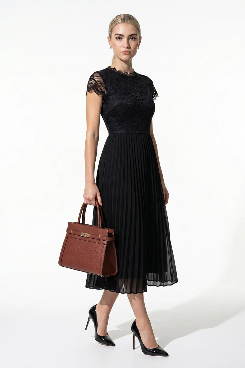Elegant black floral lace pleated A-line maxi dress by FJØRNA, perfect for wedding guests, shown full-length.