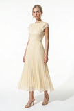 FJØRNA floral lace pleated A-line maxi dress in champagne, elegant summer wedding guest dress, full-body view.