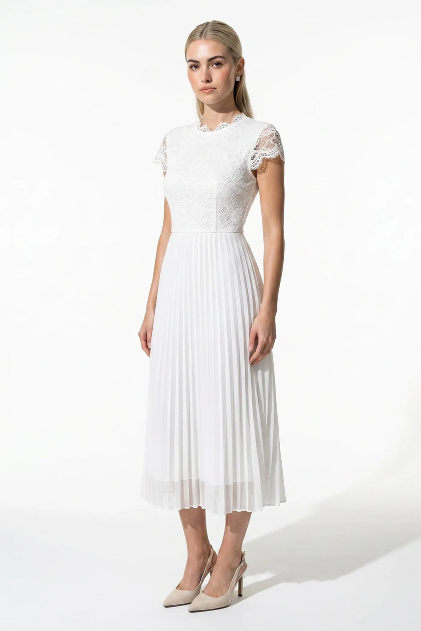 White floral lace pleated A-line maxi dress by FJØRNA, full-body view, perfect for wedding guests and summer occasions.