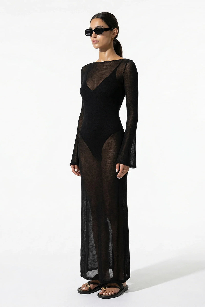Black women's long-sleeve flowing maxi dress by FJØRNA, perfect for summer beachwear, shown as a full-body view.