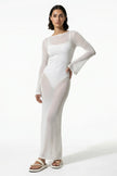 White women's long-sleeve flowing maxi dress by FJØRNA, perfect for summer beachwear, shown on a model.