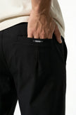 Men's slim fit stretch chino trousers by FJØRNA in black, featuring a sleek, modern design and tailored fit for stylish comfort.