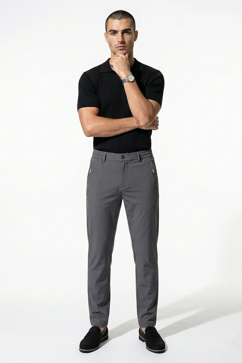 Men's dark grey slim fit stretch chino trousers by FJØRNA, shown as full body view, tailored and versatile for casual or smart wear.