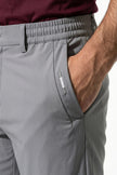 Men's slim fit stretch chino trousers in light grey by FJØRNA, featuring a sleek, tailored design and comfortable fit.