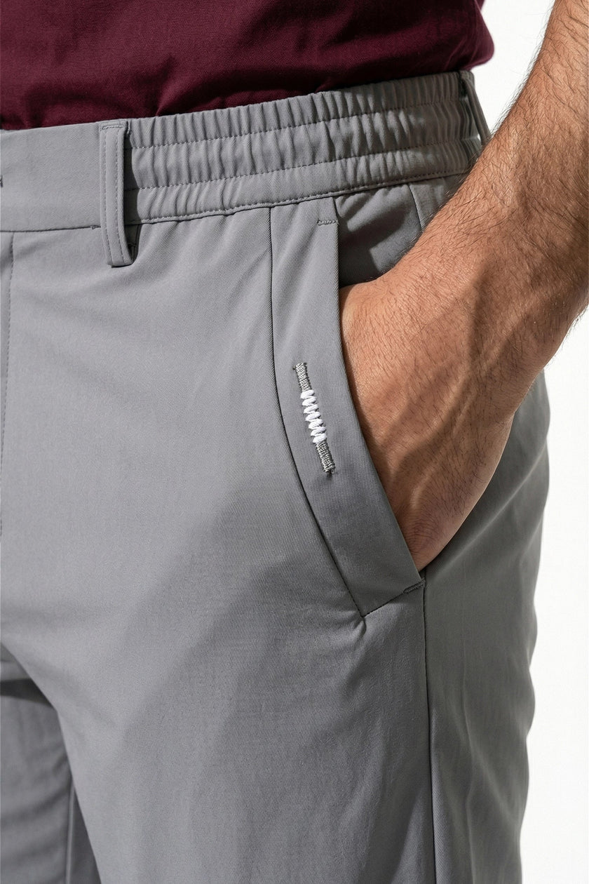 Men's slim fit stretch chino trousers in light grey by FJØRNA, featuring a sleek, tailored design and comfortable fit.