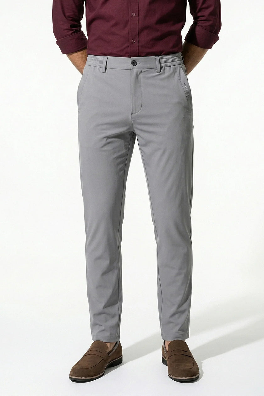 Light grey men's slim fit stretch chino trousers by FJØRNA, fitted and stylish men's pants with a modern, slim silhouette.