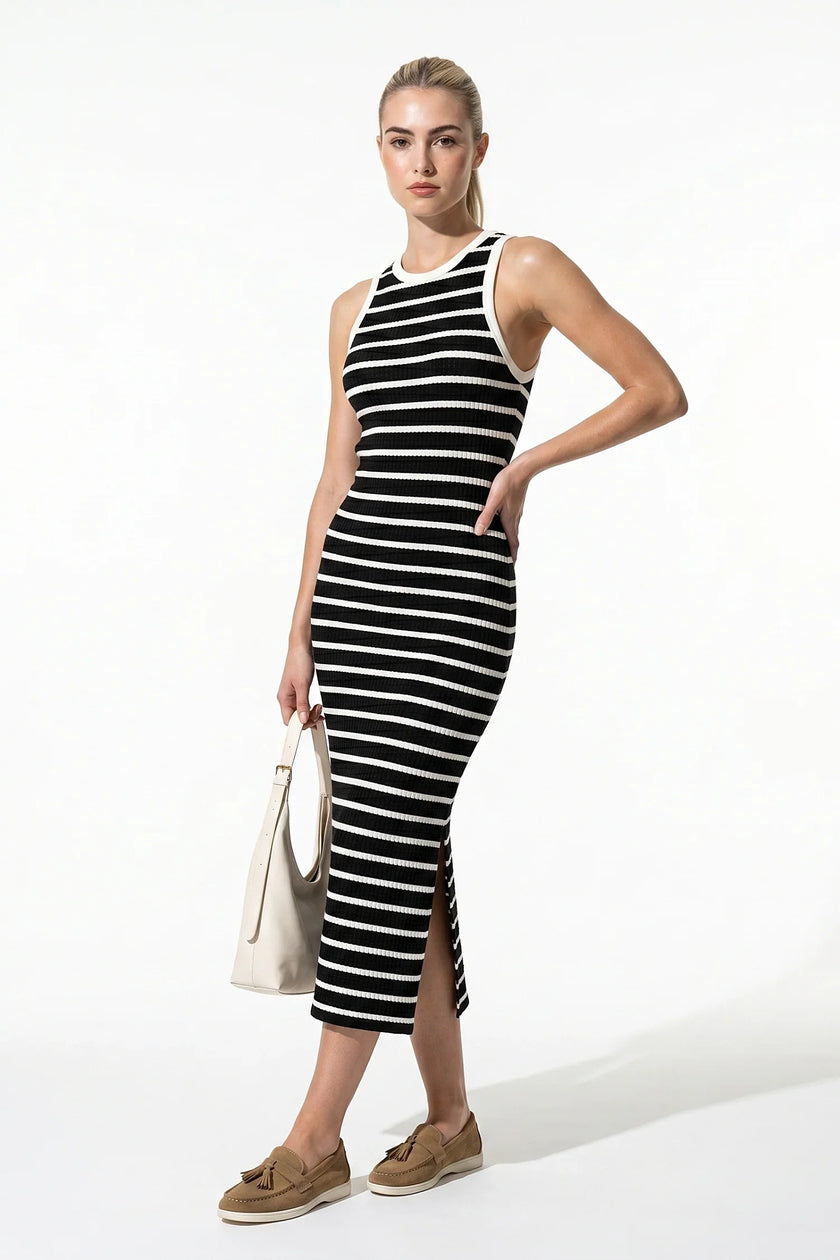 Black ribbed midi dress by FJØRNA, sleeveless, slim fit, casual women’s dress shown full body view.