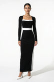 Black and white monochrome bodycon maxi dress for women by FJØRNA, shown from a 3/4 front view highlighting fitted silhouette.