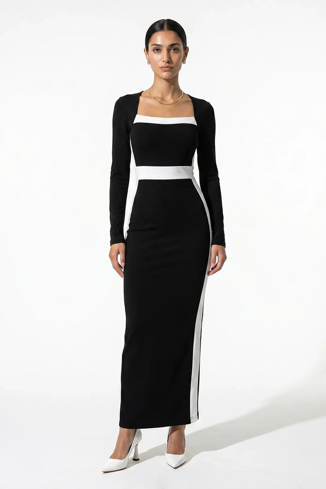 Black and white monochrome bodycon maxi dress for women by FJØRNA, shown from a 3/4 front view highlighting fitted silhouette.