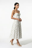 Green floral sleeveless midi dress for women by FJØRNA, lightweight summer dress with a flowing, casual style.
