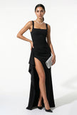 Black high-slit sleeveless maxi dress for women by FJØRNA, shown on a model with a flowing silhouette and elegant design.