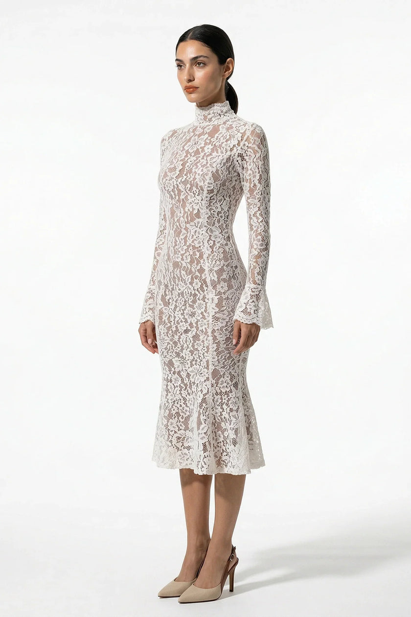 Side view of FJØRNA white lace midi dress for women with long sleeves, fitted silhouette and elegant design.