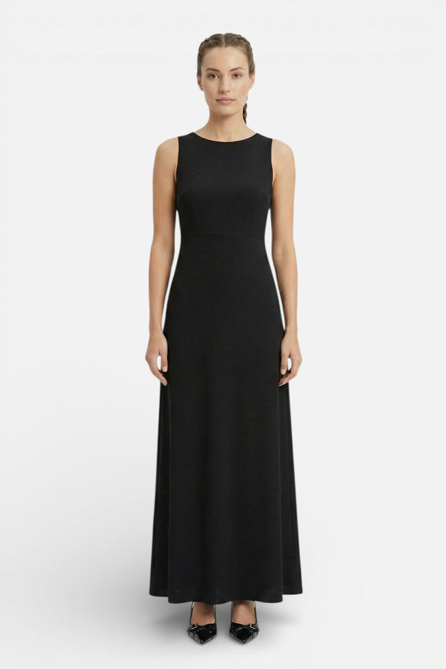 Flowing sleeveless women's maxi dress by FJØRNA, perfect for casual summer wear, shown in a coastal-inspired style.