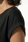 Black FJØRNA women's pleated midi A-line dress with round neckline, casual style, shown on a hanger.