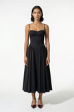 Black FJØRNA sleeveless pleated backless midi dress with halter neck, perfect for occasion wear, shown on a model.