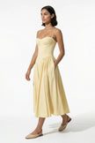 FJØRNA butter yellow sleeveless pleated halter backless midi dress, full-body view, elegant occasion dress for women