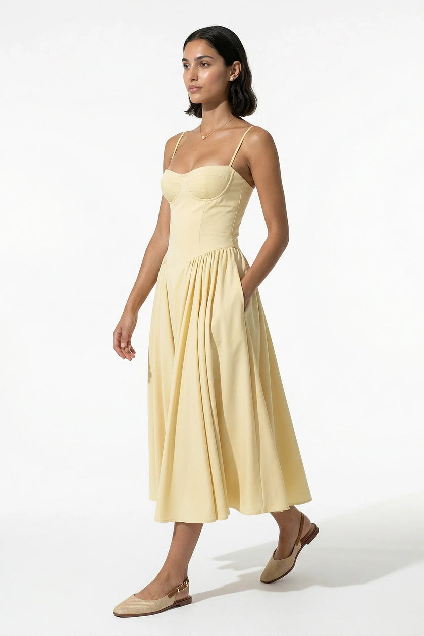 FJØRNA butter yellow sleeveless pleated halter backless midi dress, full-body view, elegant occasion dress for women