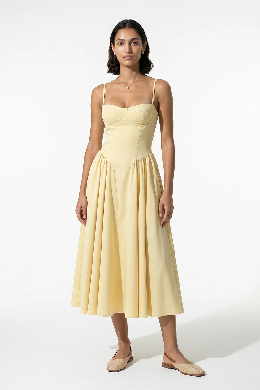 FJØRNA women's sleeveless yellow pleated halter backless midi dress, elegant occasion dress with a flowing, stylish design.