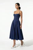 Deep blue FJØRNA sleeveless backless pleated midi dress with halter neckline, ideal for occasions, full-body view.